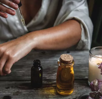 A person trying beauty product on hand