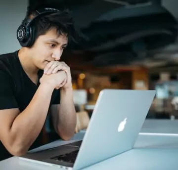 A person watching online course on laptop