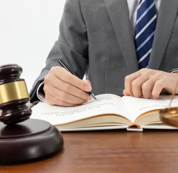 A legal person writing on note
