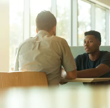 Two people are discussing