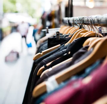 Clothes hanging in retail shop