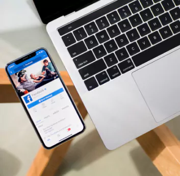 Image of mobile and laptop on desk